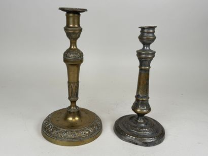 Two ormolu torches, one decorated with vases...