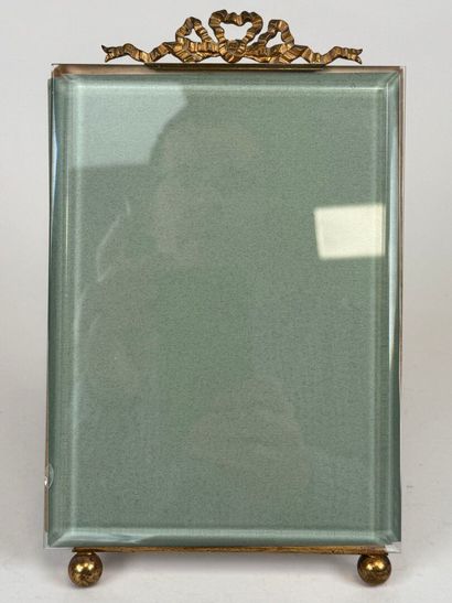 Large photo frame in beveled glass and chased...