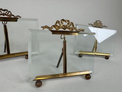 Three picture frames in brass and beveled...