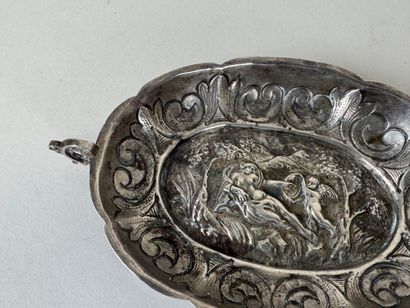 Small oval repoussé silver bowl decorated...