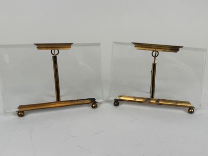 Two beveled glass and brass picture frames.
10...