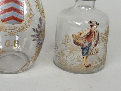 Deux carafes en verre à décor émaillé et...