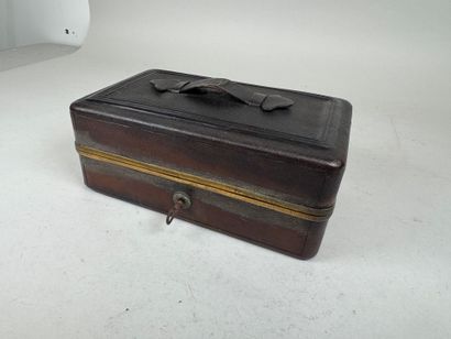 Brown leather travel case, numbered on the...