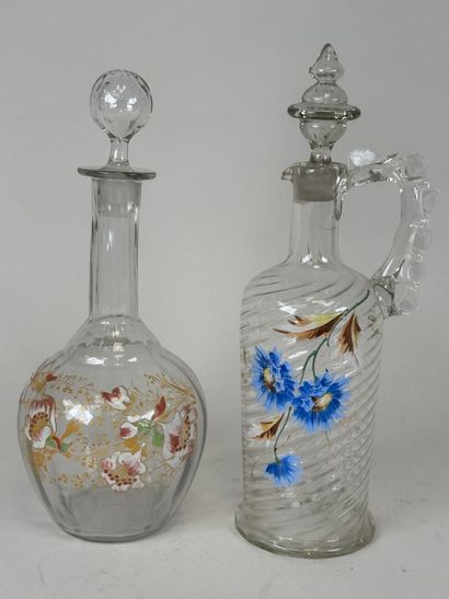 Deux carafes en verre à décor émaillé et...