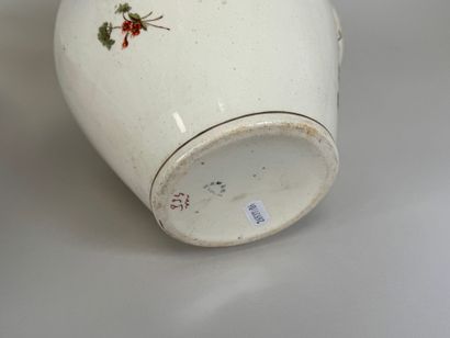 HAMAGE.
A polychrome and gold earthenware...