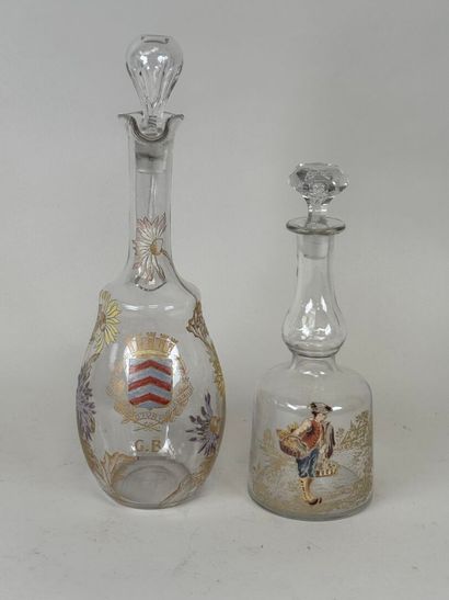 Deux carafes en verre à décor émaillé et...