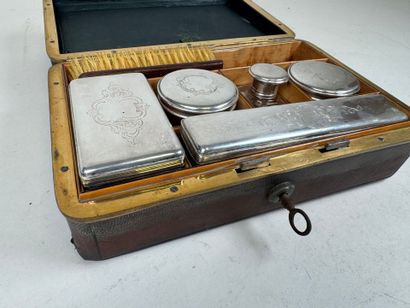 Brown leather travel case, numbered on the...