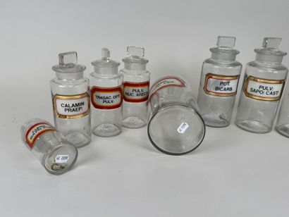 8 clear glass medicine jars.
H. 13-16-19-24...