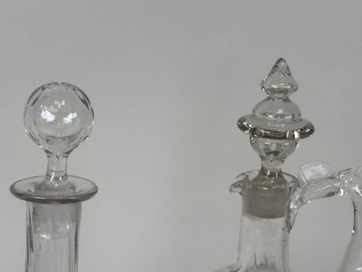 Deux carafes en verre à décor émaillé et...