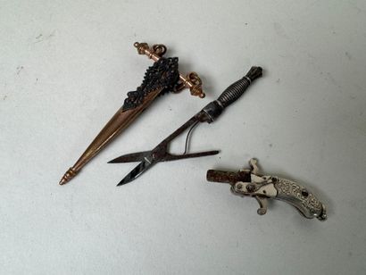 Small pair of scissors or probable dagger-shaped...