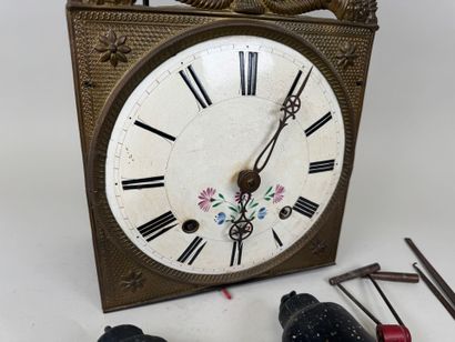 Comtoise movement in repoussé brass, with...
