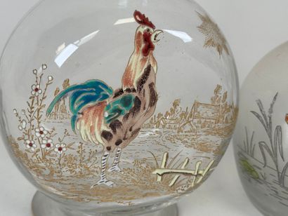 Deux carafes en verre à décor émaillé polychrome...