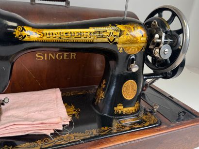 The SINGER Manufacturing.
Machine à coudre...