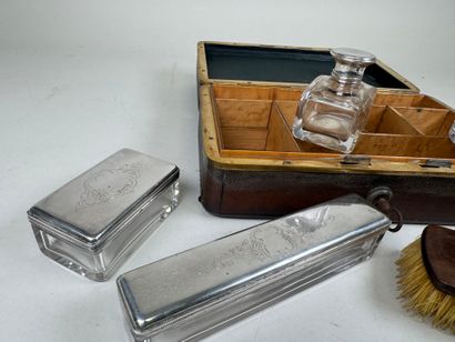 Brown leather travel case, numbered on the...