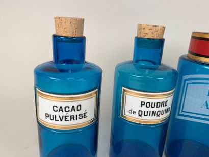 Two pairs of colored glass medicine bottles...