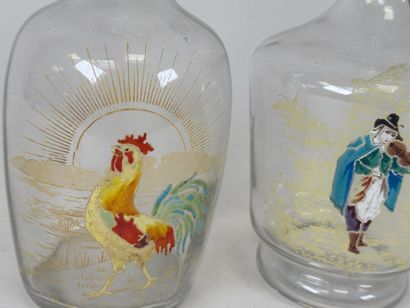 Deux carafes en verre à décor émaillé et...