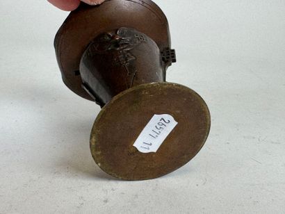 ASIA, 20th C. Small patinated bronze candlestick...
