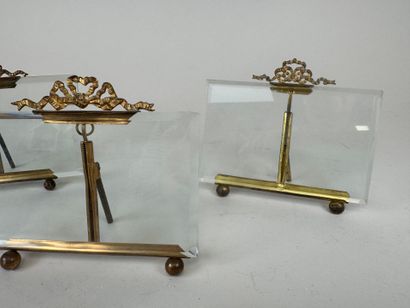 Three picture frames in brass and beveled...