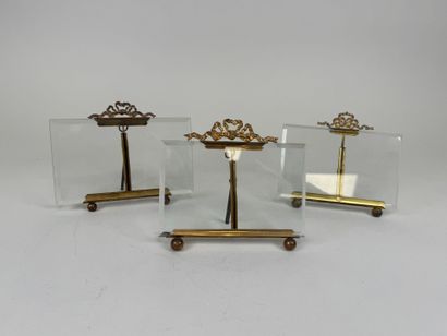 Three picture frames in brass and beveled...