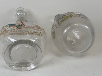 Deux carafes en verre à décor émaillé polychrome...