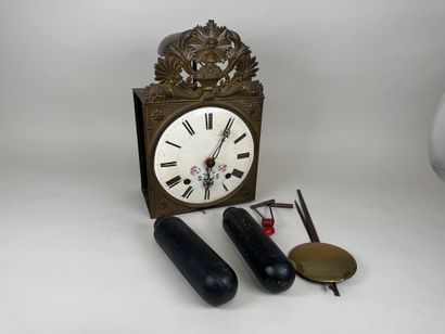 Comtoise movement in repoussé brass, with...