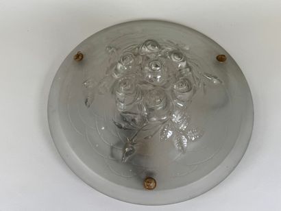 Circular frosted glass bowl with roses in...