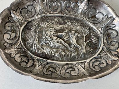 Small oval repoussé silver bowl decorated...