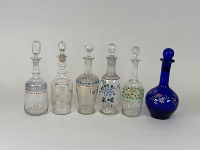 Six carafons en verre à décor émaillé et...