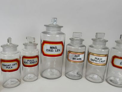 8 clear glass medicine jars.
H. 13-16-19-24...