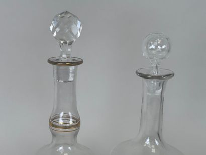 Deux carafes en verre à décor émaillé et...