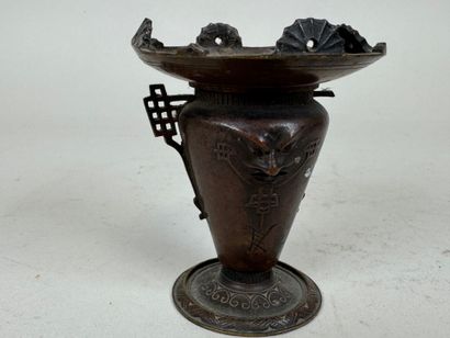 ASIA, 20th C. Small patinated bronze candlestick...