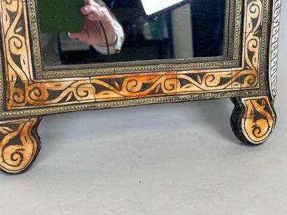 Copper alloy mirror with repoussé decoration...