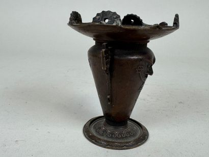 ASIA, 20th C. Small patinated bronze candlestick...
