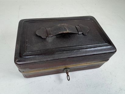 Brown leather travel case, numbered on the...
