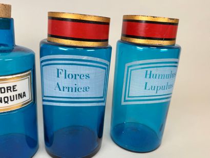 Two pairs of colored glass medicine bottles...
