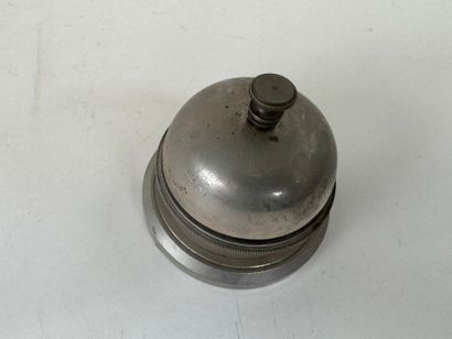 Circular metal table bell.
D. 8.5 cm.
(w...