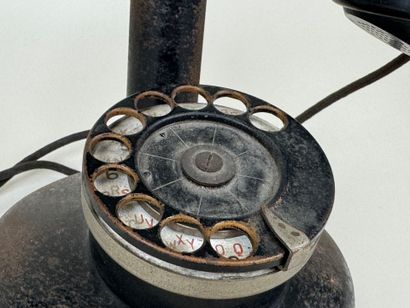 ERICSON telephone company.
Metal and bakelite...