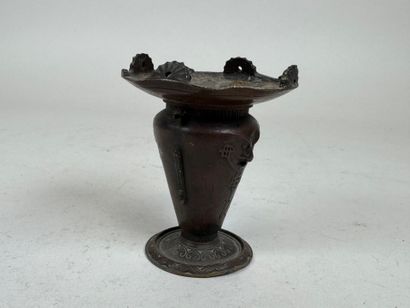 ASIA, 20th C. Small patinated bronze candlestick...