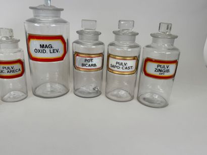 8 clear glass medicine jars.
H. 13-16-19-24...