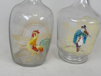 Deux carafes en verre à décor émaillé et...