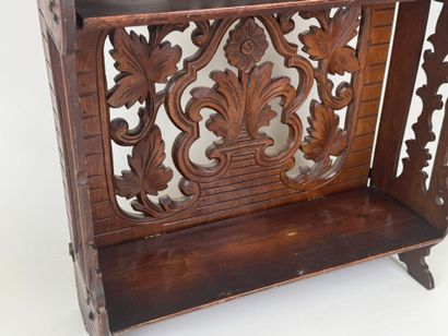 Small shelf in molded and carved wood with...