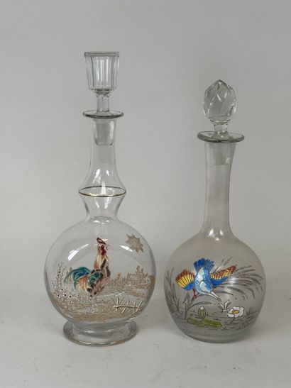 Deux carafes en verre à décor émaillé polychrome...