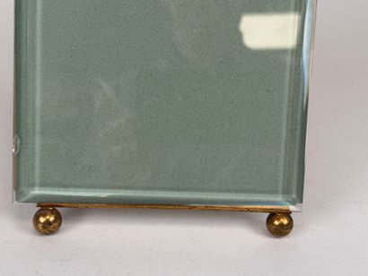 Large photo frame in beveled glass and chased...