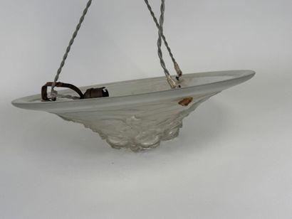 Circular frosted glass bowl with roses in...