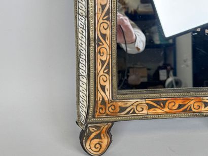 Copper alloy mirror with repoussé decoration...