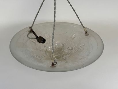 Circular frosted glass bowl with roses in...