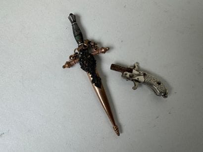 Small pair of scissors or probable dagger-shaped...