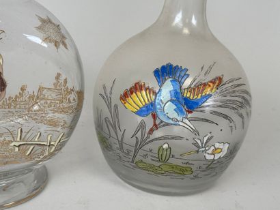 Deux carafes en verre à décor émaillé polychrome...