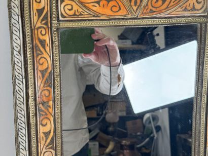 Copper alloy mirror with repoussé decoration...