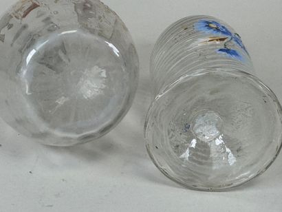 Deux carafes en verre à décor émaillé et...